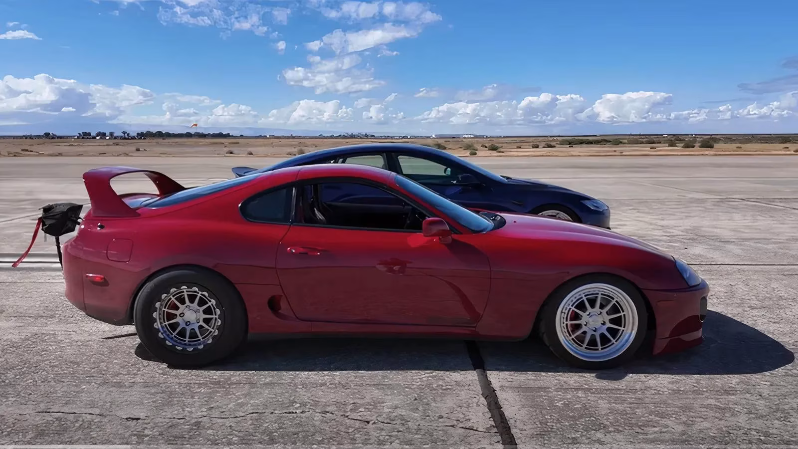 custom-supra-mk4-outruns-tesla-plaid-ice-vs-ev-drag-race-showdown-image-0